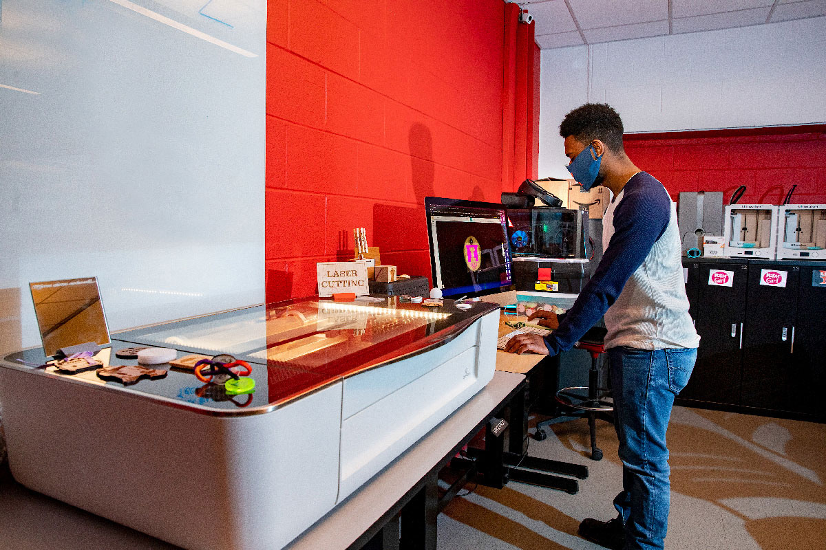 Student working on a 3D printer